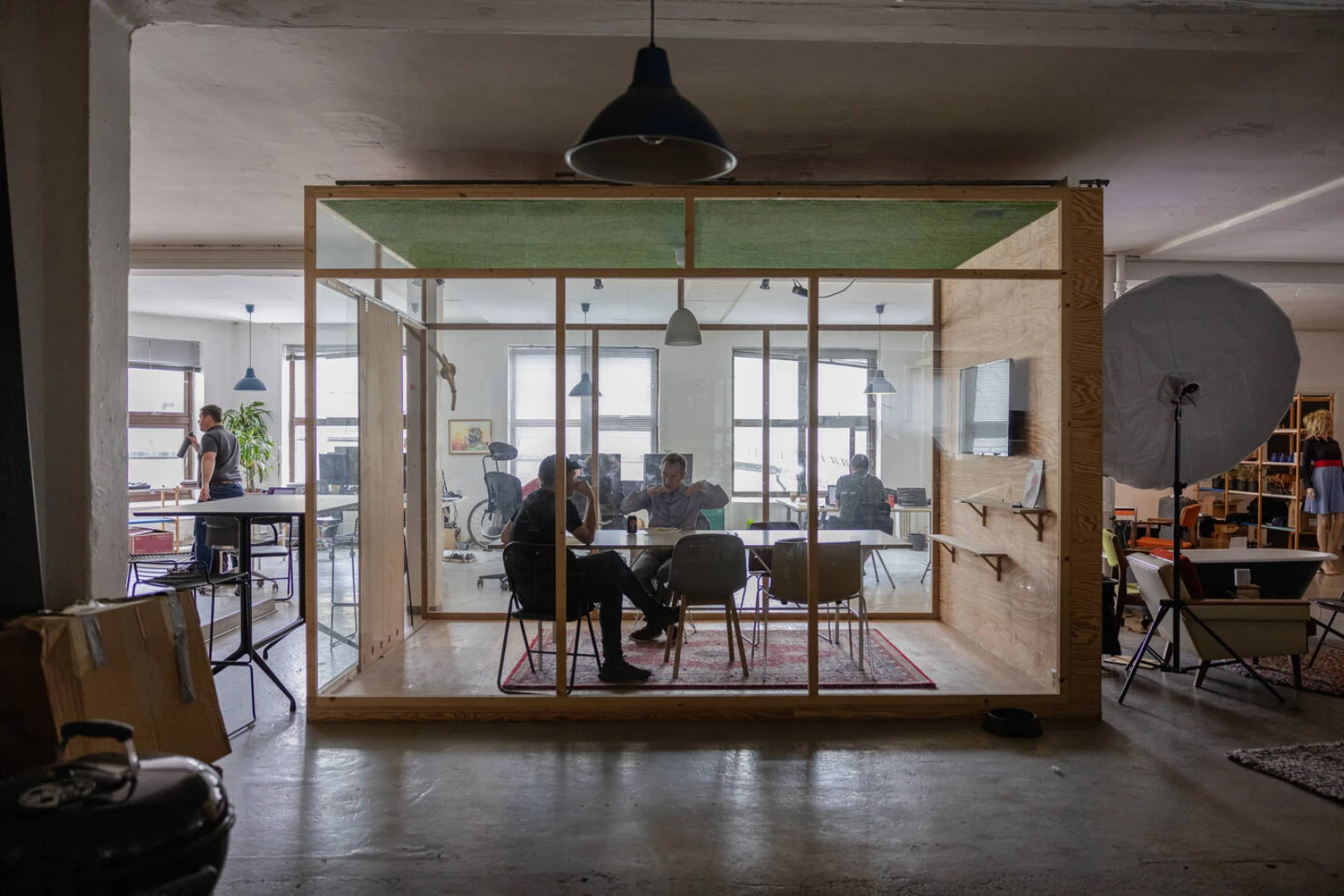 Two people talking in a meeting room